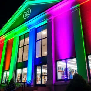 Hesburgh Library lit up in vibrant colors for Rare Disease Day