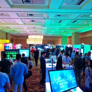 Attendees engaging at TECHSPO Los Angeles 2025 featuring innovative technology displays.