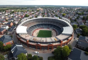 Aerial view of Memorial Stadium with renovations amidst residential homes
